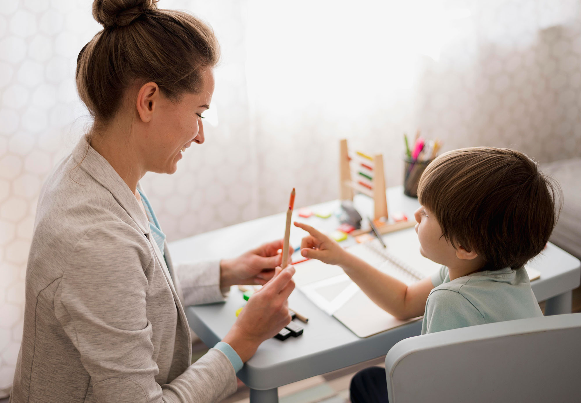 side-view-child-tutor-home-learning-low side-view-child-tutor-home-learning-low
