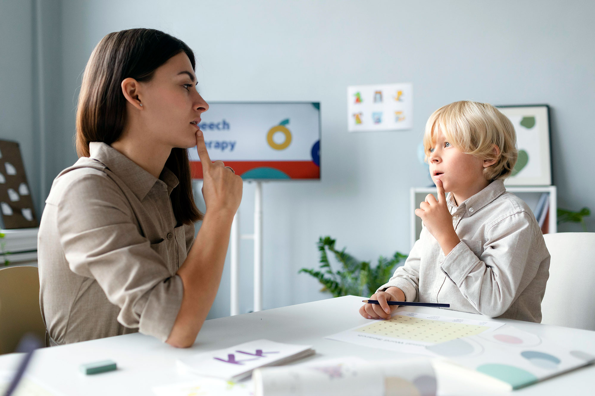 woman-doing-speech-therapy-with-little-blonde-boy-low2